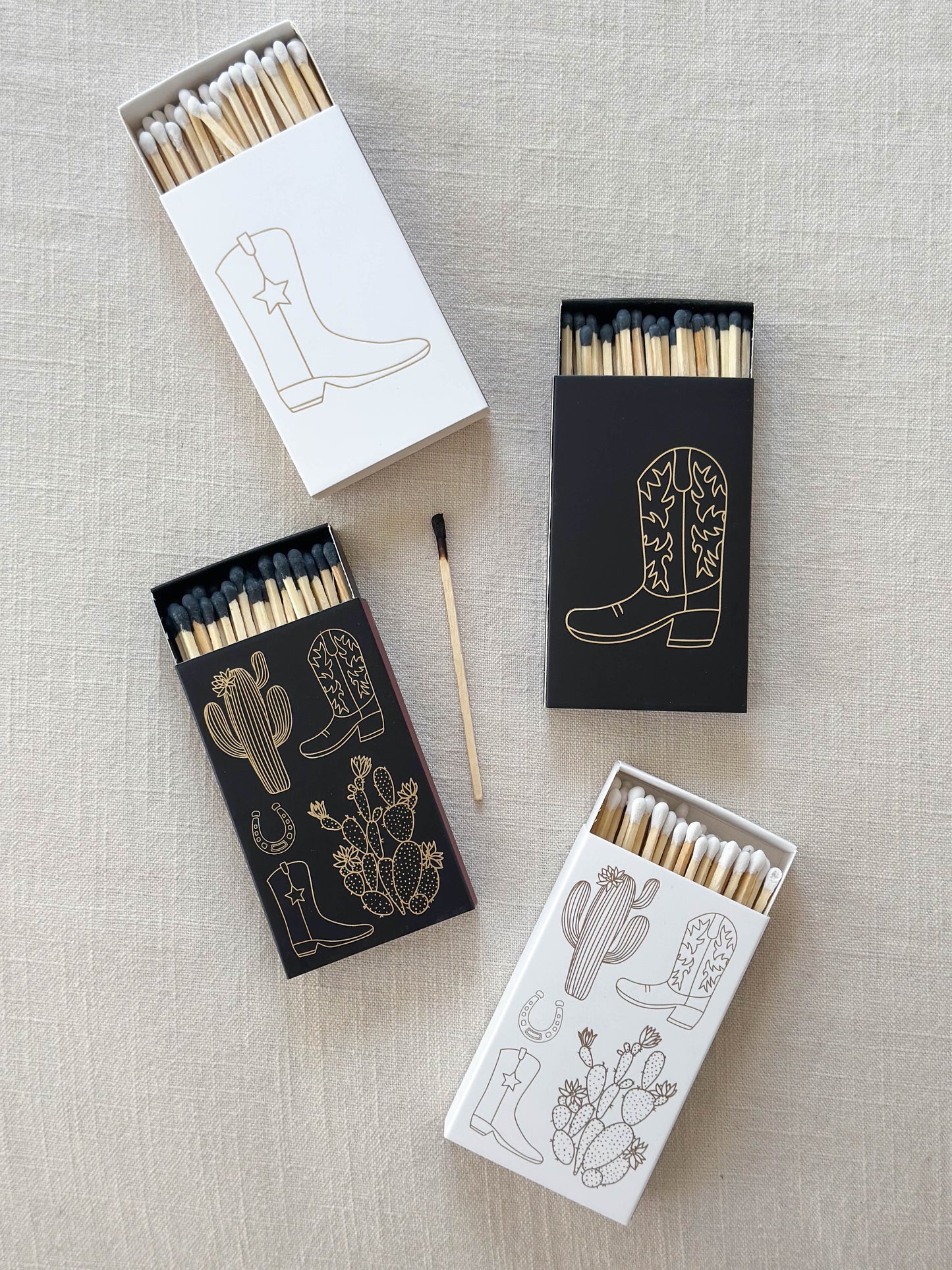 Cowboy boot and cactus safety matches in black and white