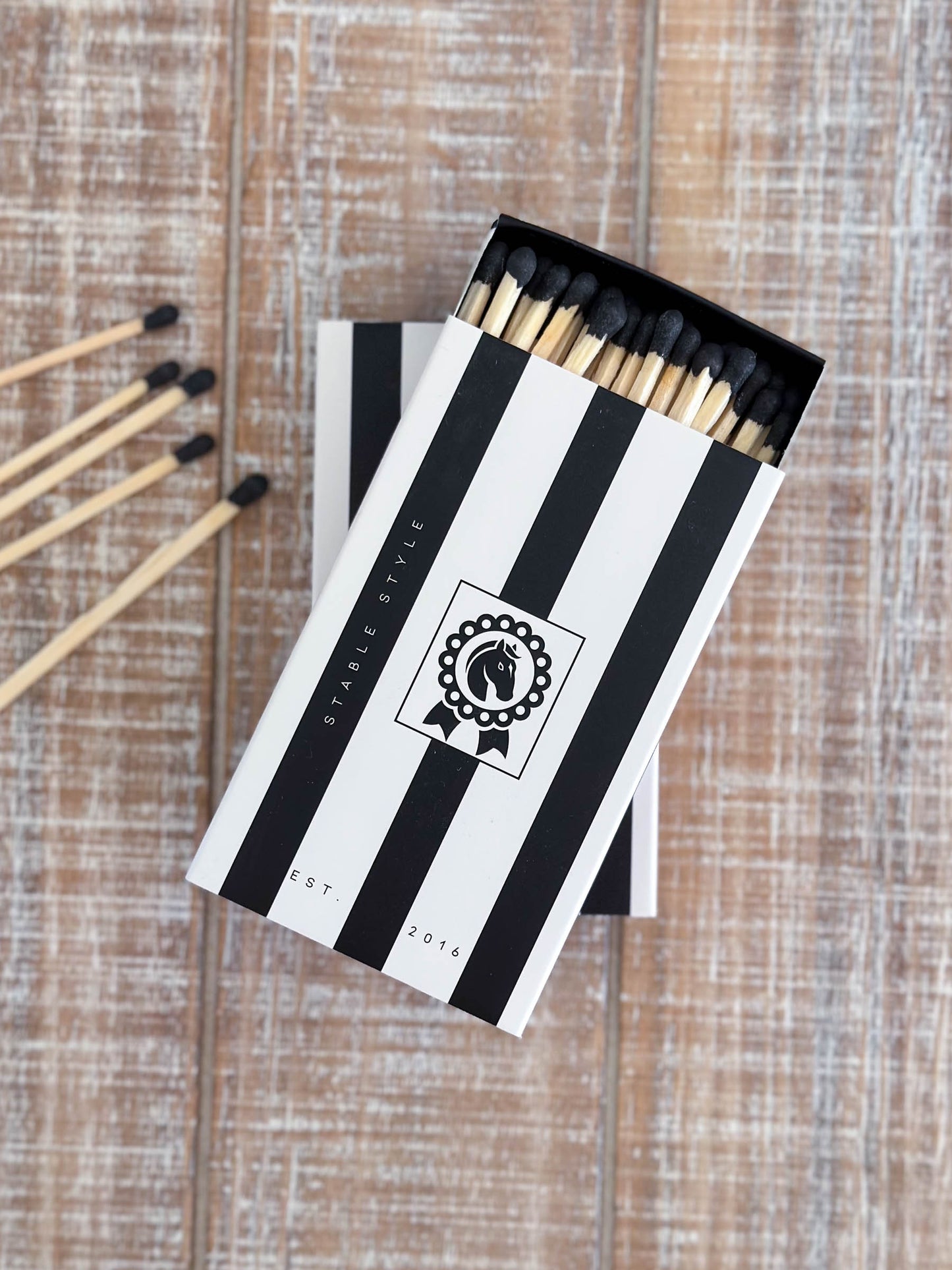 equestrian match box with black and white stripes